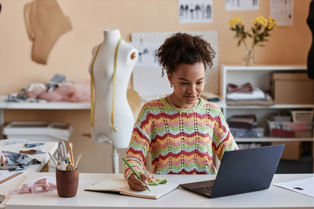 Young African American craftswoman watching online educational video